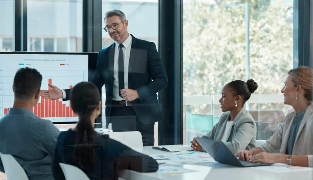 A business man directing a meeting